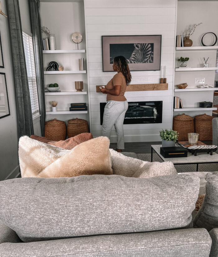 tasha next to shelves